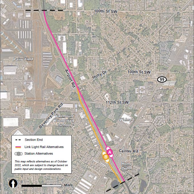 This map reflects the SR 99 / Airport Road route and station alternatives as of October 2022, which are subject to change based on public input and design considerations. The station area is shown in a zoomed-out view that illustrates the potential routes stretching from Airport Road and SR 99 to the intersection of Airport Road and 100th Street SW. Map shows the SR 99 / Airport Road station area, located at the intersection of the two roads. The two station alternatives shown near the area are labeled A and B. The two route alternatives shown are colored pink and yellow. The pink route shows the representative project, which runs along the north side of Airport Road, intersecting station location A just west of SR 99. The pink route then continues up the north side of Airport Road. The yellow route runs along the south side of Airport Road, intersecting station location B just west of SR 99. The yellow route then continues up the south side of Airport Road.