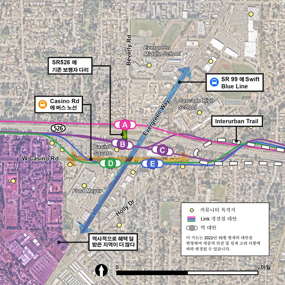 SR 526 Evergreen 역 지역을 주요 기업, 커뮤니티 서비스, 주차 및 기존 대중교통과 같은 기능과 같은 커뮤니티 기능과 목적지를 보여주는 지도. 지도는 기존 커뮤니티 기능 및 목적지와 비교하여 대체 경로 및 역의 위치를 보여줍니다. 이 지도는 일반적으로 Evergreen Way 서쪽과 SR 526 남쪽에 위치한 역사적으로 서비스가 부족한 지역사회가 있는 지역을 보여줍니다. Interurban Trail도 표시되어 있으며 Holly Drive를 건너는 SR 526을 중심으로 합니다. 기존 대중교통도 표시됩니다: Evergreen Way를 따라가는 Swift Blue Line과 Casino Road를 따라가는 버스 노선. SR 526에서 Beverly Road까지의 기존 보행자 다리도 지도에 표시됩니다.